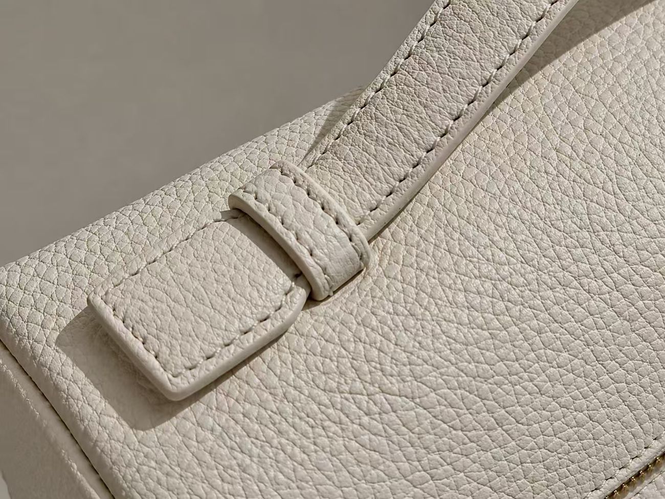 Close detail of leather edge finishing and construction