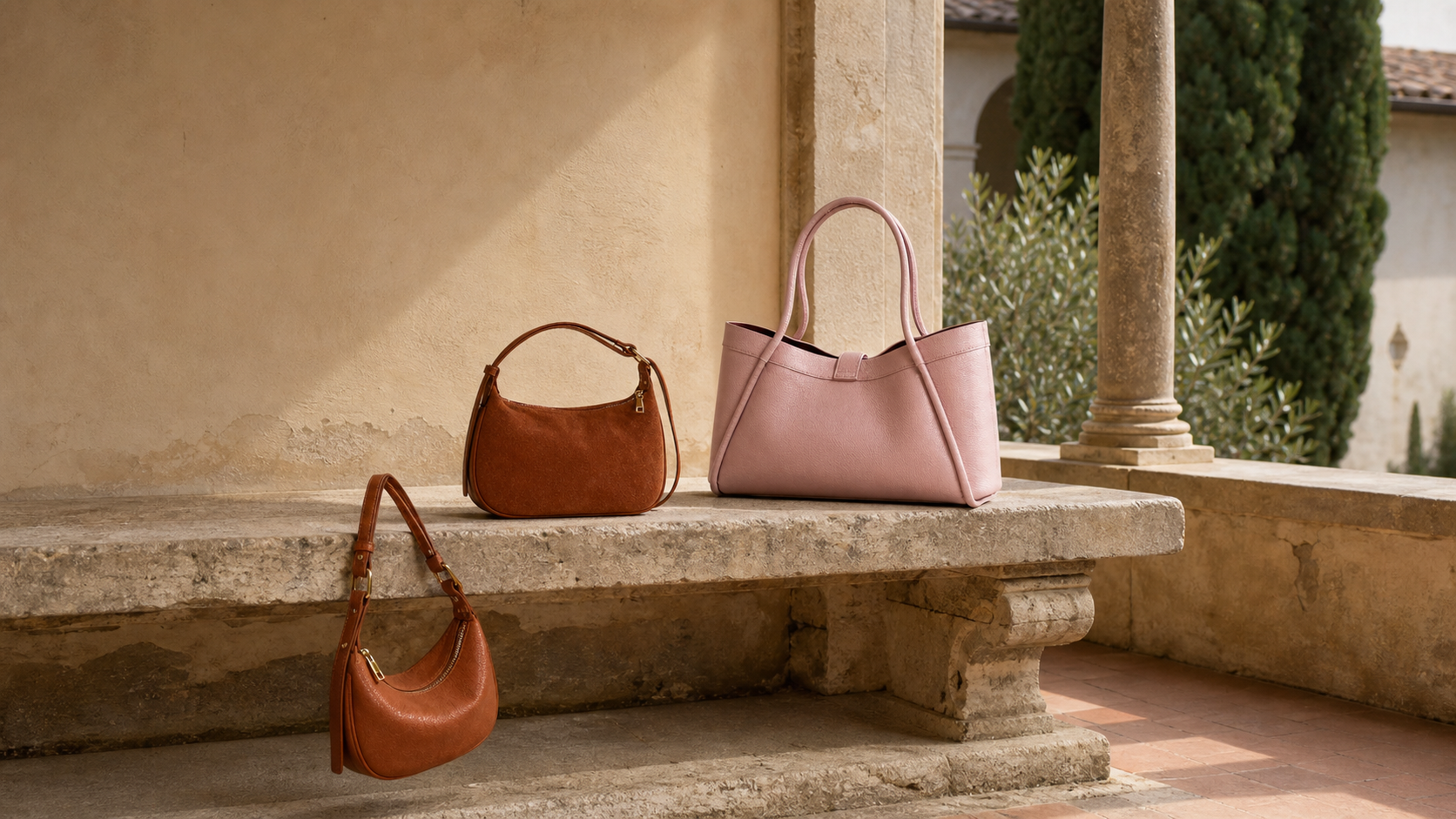 Three FRAYDA leather bags in a sunlit Tuscan cloister