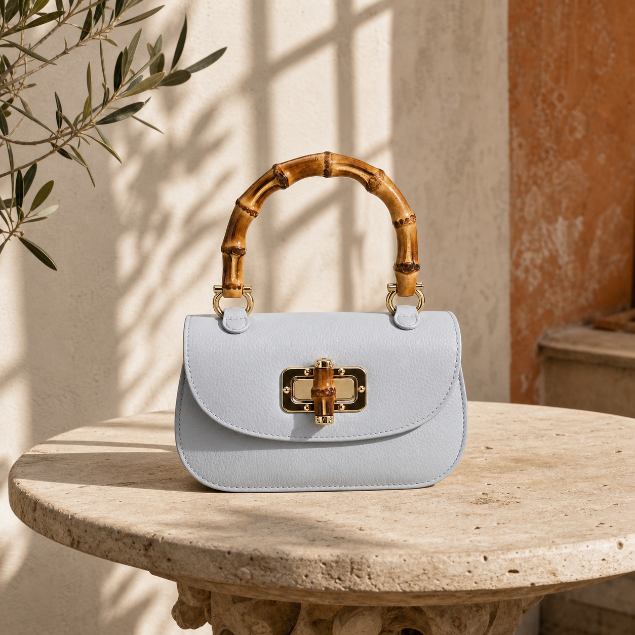 A physical leather bag sample reviewed in a restrained Italian setting