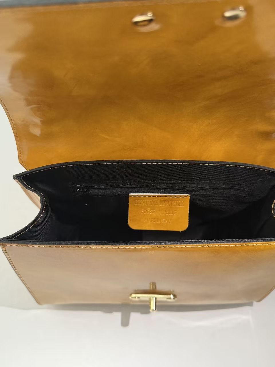 A finished leather bag checked for shape, construction and surface quality